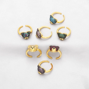 Set of seven golden adjustable bear rings with colorful sparkling cubic zirconia stones