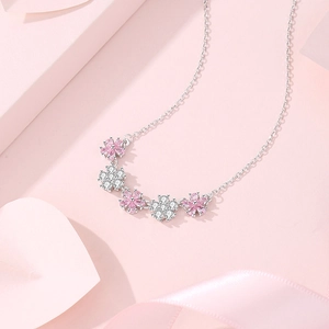 Elegant S925 sterling silver necklace with five pink and white flower pendants on pink ribbon