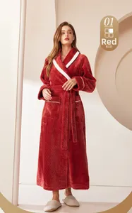 Detail of red plush flannel bathrobe with white contrast trim and belted waist design