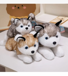 Close-up of fluffy husky plush toys with blue eyes and realistic soft grey fur detail