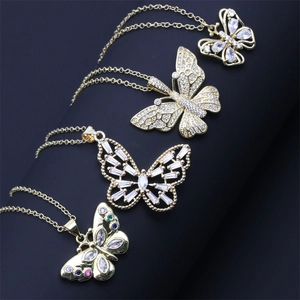 Detail of four 18K gold-plated butterfly necklaces featuring micro-pave cubic zirconia