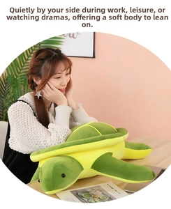 Large plush sea turtle pillow shown being held to demonstrate soft texture and size