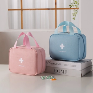 Portable first aid kit bags in pink and blue for travel medical supplies storage