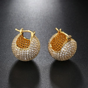 Detailed view of gold plated ball hoop earrings with micro-paved sparkling cubic zirconia