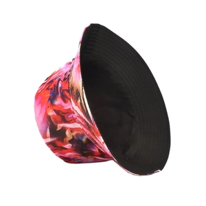 Detail of colorful tie-dye bucket hat showing black reversible inner lining side