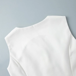 Detail of V-neck collar and shoulder on a white vest made of premium suiting fabric