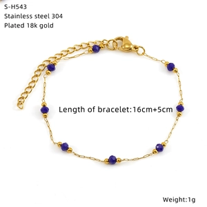 Detailed view of 18K gold plated stainless steel bracelet with dark blue glass beads
