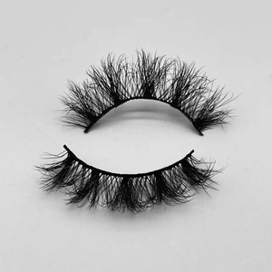 Macro view showing texture and volume of black voluminous mink-style false eyelashes