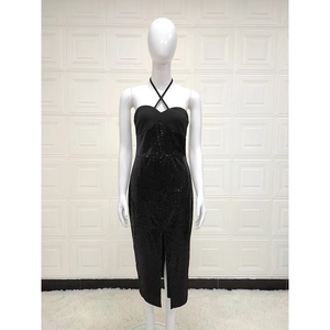 Women's black sequin halter midi dress with a stylish front slit for summer parties