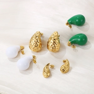 Detailed flat lay of 18K gold stainless steel teardrop earrings with hammered texture