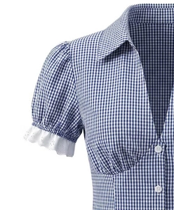 Detail of blue and white plaid shirt with lace cuffs and white buttons on cotton fabric