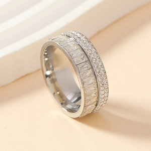 Luxurious stainless steel wide band ring with emerald cut and pavé set cubic zirconia
