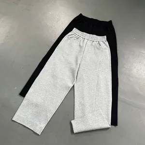 Loose fit casual pants with curved seam design in black and light grey colors