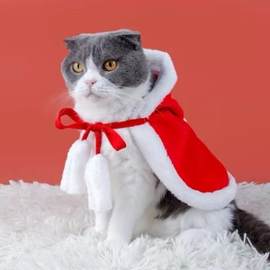 Festive red pet Christmas cloak with white fur trim and pom-pom for cats and small dogs