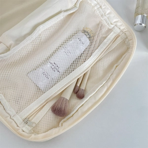 Internal view of the quilted rabbit cosmetic bag showing mesh pocket and spacious storage