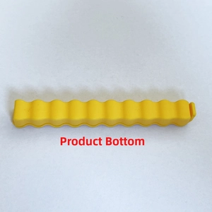 Bottom view of a yellow plastic fries bag sealer with wavy texture and locking buckle