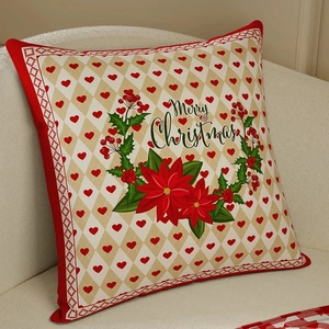 Red plaid Christmas cushion cover with Merry Christmas heart wreath on a cozy sofa