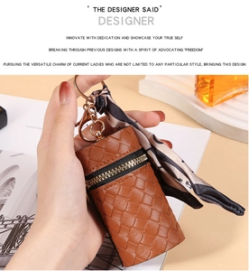 Brown woven cylindrical coin purse with gold clasp and decorative printed silk scarf detail