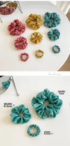 Three sizes of metallic hair scrunchies in pink, gold and blue with width labels