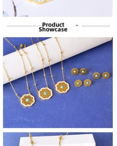Detailed view of bohemian gold hollow flower necklace and earrings with turquoise stone