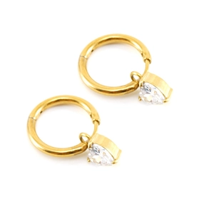 Detail of gold heart earrings featuring sparkling white zircon stones on round hoops