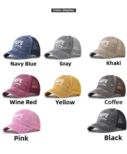 Detail view of cotton trucker caps in eight colors featuring NOPE embroidered text