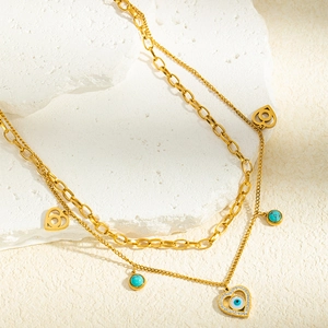 Collier double rang en acier doré avec cœur, émail œil bleu et zircons étincelants