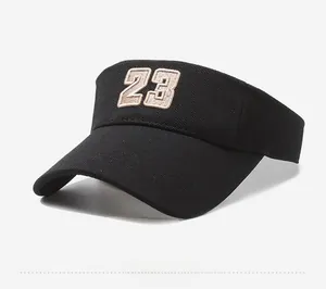 Detail shot of black sun visor with premium 3D embroidered number 23 on high-density fabric