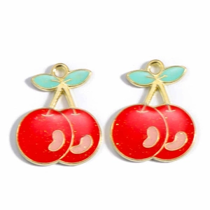 Detail view of red enamel cherry pendants with glitter finish and gold plated alloy edges