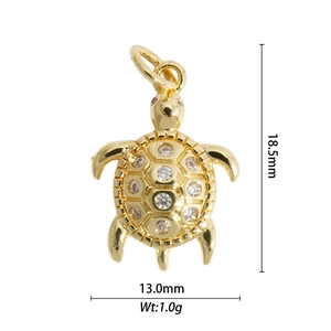 Detailed view of gold sea turtle pendant with crystal rhinestones and size measurements