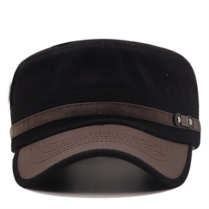 Detail of military cap with black crown, brown brim and leather strap with FS metal rivet