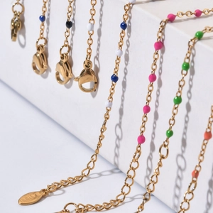 Detail of colorful beads on gold stainless steel chain with lobster clasp and extender