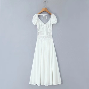 Detailed back view of white backless dress with ruched waist and short puff sleeves