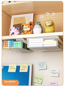 Detail view of a translucent under-desk drawer storage box mounted on a wooden shelf