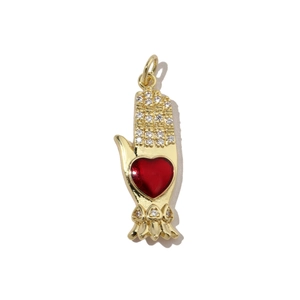 Detailed close-up of golden palm pendant with a red heart and sparkling zircon stones
