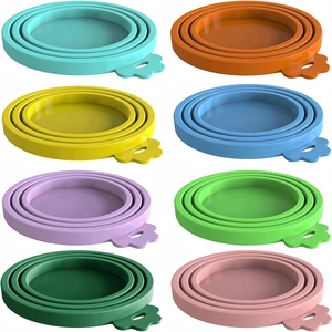 Universal silicone pet can covers in eight vibrant colors displayed in a grid on white background