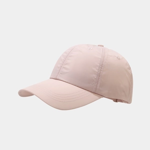 Detail of light pink quick-dry baseball cap showing stitching and breathable fabric