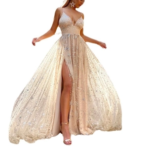 Detail of champagne mesh evening gown featuring sparkling star sequins and high side slit
