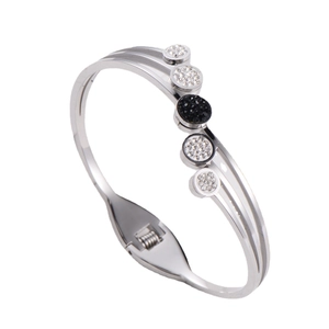 Elegant multi-layered silver steel bangle featuring black and white pave crystals