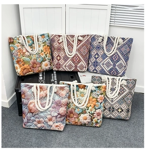 Detailed display of six colorful canvas tote bags with ethnic embroidery and rope handles