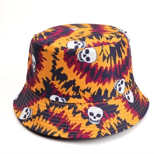 Halloween bucket hat with orange tie-dye and white skull print for a punk hip-hop look