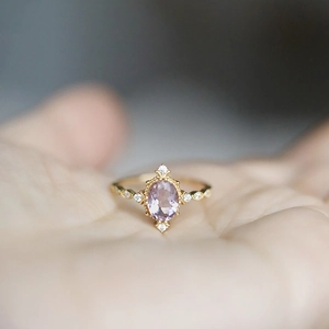 Vintage 14K gold plated silver ring with oval amethyst and side diamonds on finger