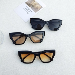 Minimalist cat eye sunglasses with stylish black frame and assorted gradient color lenses