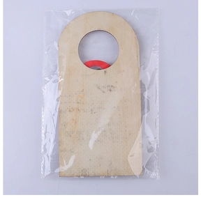 Clear plastic packaging showing a natural wooden Christmas door handle hanger ornament