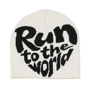 Detail of knit beanie featuring black 'Run to the world' heart-shaped jacquard lettering