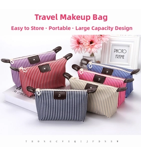 Detailed view of striped travel toiletry bags in various colors with leather flap closure