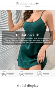 Detail of dark green satin sleepwear showing smooth texture and laundry care icons