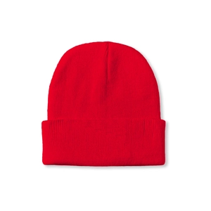 Detail of red ribbed knit beanie featuring soft texture and folded cuff for winter warmth