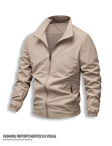 Close-up of khaki casual outdoor jacket with standing collar and secure zip pockets