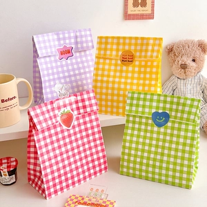 Detail view of colorful checkered gift bags in purple, yellow, pink and green tones